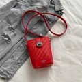 Chic bright red woven bucket bag with metallic silver clasp and shoulder strap - Red