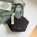 Fashionable black nylon tote bag with cherry print and chic cream webbing strap - Black Cherry
