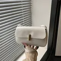 Minimalist white patent leather crossbody bag with elegant gold metal lock - White