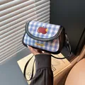 Blue and white checkered saddle bag with apple pattern and black leather shoulder strap - Black