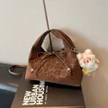Dark brown leopard print dumpling bag with bow detail and plush charm pendant - Coffee With Pendant