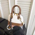 Chic cream and brown shell-shaped handbag with top handle and crossbody strap - Single Bag / White