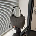 Sac seau gris foncé imprimé léopard avec nœuds et détails métalliques dorés - Gris