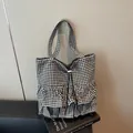 Chic black and white checkered canvas tote bag with ruffled hem and drawstring closure - Black