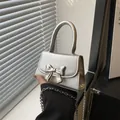 Mini silver shiny leather handbag with oversized metallic bow and fine chain strap - Silver