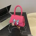 Hot pink mini crossbody bag with silver metal bow and detachable chain strap - Rose Red