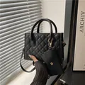 Chic black quilted crossbody handbag with matching coin purse and gold-tone hardware - Black