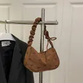Vintage brown corduroy underarm bag with black bow print and pleated handle - Brown