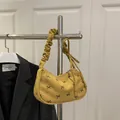 Yellow corduroy shoulder bag with black bow print and stylish ruched strap detail - Yellow