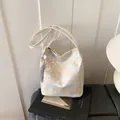 Elegant off-white tote bag with gold Chinese landscape embroidery and silk tassel - White