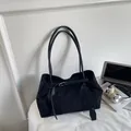 Large black suede tote bag with decorative buckle straps and long shoulder handles - Black