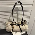 Minimalist beige suede tote bag with black leather straps and beaded tassel detail - Khaki