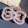 Pink iridescent hollow bow hair claw clip made of acrylic with aurora light effect - Butterfly Shape Claw / Pink