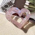 Pink heart hair claw clip with holographic effect and golden metal spring mechanism - Hollow Heart Claw Clip / Iridescent Pink