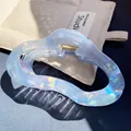 Iridescent light blue hair claw clip with pearlescent finish and gold metal spring - Wavy Cloud Claw / Blue