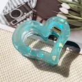 Water blue heart-shaped hair claw clip with holographic texture and sturdy resin finish - Hollow Heart Claw / Iridescent Green