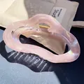 Translucent iridescent light pink claw clip in large size with marbled resin texture - Wavy Cloud Claw / Light Pink