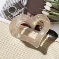 Iridescent heart-shaped hair claw clip in creamy pearl finish with gold spring - Hollow Heart Claw / Iridescent Beige