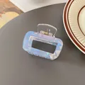 Iridescent light blue rectangular hair claw clip with shell texture and gold spring - Rectangular Hollow Claw / Iridescent Blue
