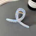 Iridescent translucent hair claw clip with a twisted ribbon design and gold spring - Cross Twist Hair Claw / Colorful Light Blue