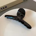 Pince à cheveux noire brillante en acétate avec logo doré pour cheveux épais - Pince à Cheveux Noir