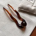 Forcina a U in acetato ambrato con dettaglio a sfera per acconciature eleganti - Forcina U Perlina Caffè