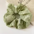 Pale green lace scrunchie with floral embroidery and mesh texture for hair styling - Scrunchie Style / Bean Green