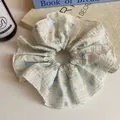 Pastel blue checkered scrunchie with cherry floral pattern and premium soft texture - Cherry Style