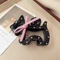 Zwarte haarclip met puppy-stippenpatroon en roze strikdetail voor dames - Zwart Stippen Hond Haarklem