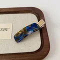 Barrette rectangulaire élégante en acétate avec motif marbré bleu et marron et métal doré - Pince à bec bleu saphir