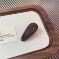 Dark brown oval acetate hair clip with gold France Handmade lettering on wood tray - Dark Brown Waterdrop Clip