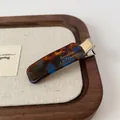 Barrette vintage en acétate avec motif écaille de tortue marron foncé et bleu saphir - Pince à bec bleu-marron