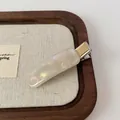 Rectangle pearlescent white acetate hair clip with gold metal base and French text - Mermaid Pearlescent Duckbill Clip