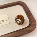 Mini round acetate hair claw in tortoiseshell finish with black number 7 billiard design - Tortoiseshell Blue Brown 7