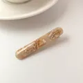Elegante fermaglio per capelli in acetato marmorizzato albicocca con scritte oro - Albicocca Lattea