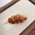 Oval tortoiseshell hair clip in dark amber acetate with handmade gold lettering - Dark Brown Oval