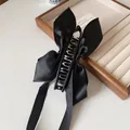 Barrette banane élégante à nœud en satin noir pour femme pour coiffure en queue de cheval - Nœud à ruban noir