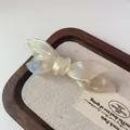 Elegant pearlescent acetate bow hair clip with Barrette La France gold engraving - Mermaid White