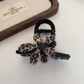 Elegant black large hair claw clip featuring a stylish leopard print flower ornament - Black Flower Claw Clip