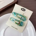 Französische Vintage Haarklammern aus Acetat mit Mosaikmuster in Meeresblau - Grün Mosaik Muster