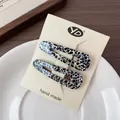 French vintage hair clip set with black and white cow pattern and gold lettering - Black White Leopard