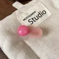 Pink round ball hair clip for women with France Handmade logo on a light pink base - Pink
