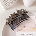 Elegant black hair comb with four brown rhinestone star accents for women - Silver Gray Stars