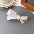 Iridescent white acetate bow hair claw clip with pearlescent finish and metal spring - Colorful White (Bow Clip)