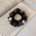 Elegant black mesh hair scrunchie featuring five large white faux pearls for women - Mesh Pearl Style