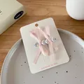 Zwei rosa Schleifen-Haarspangen mit herzförmigen Perlen und Glitzersteinen - Rosa Herz Schleife