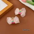 Set of two light pink organza bow hair clips with cherry embroidery and 6cm size label - Small Claw / Light Pink