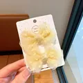 Pair of yellow mesh bow hair clips for girls with silver glitter on display card - Mesh Bow White / Yellow