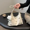White pleated underarm bag with silver butterfly charms and plush cloud pendant - With Cloud Pendant / White