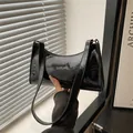 Minimalist black patent leather underarm baguette bag with glossy mirror finish - Glossy Black